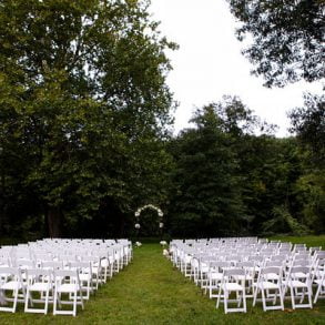 Weddings at Settlers Inn empty chairs and wedding arch